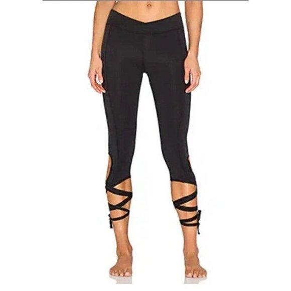 Free People Movement Turnout Crossover Waist Ankle Tie Cropped Leggings in Black - Picture 1 of 11